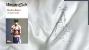 En arrière-plan, des gants de boxe, et au premier plan, la couverture du livre de Charles Aubert, Danser encore